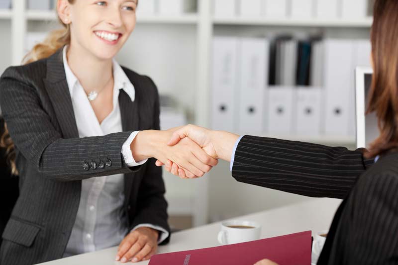 Attorney shaking hands with a client